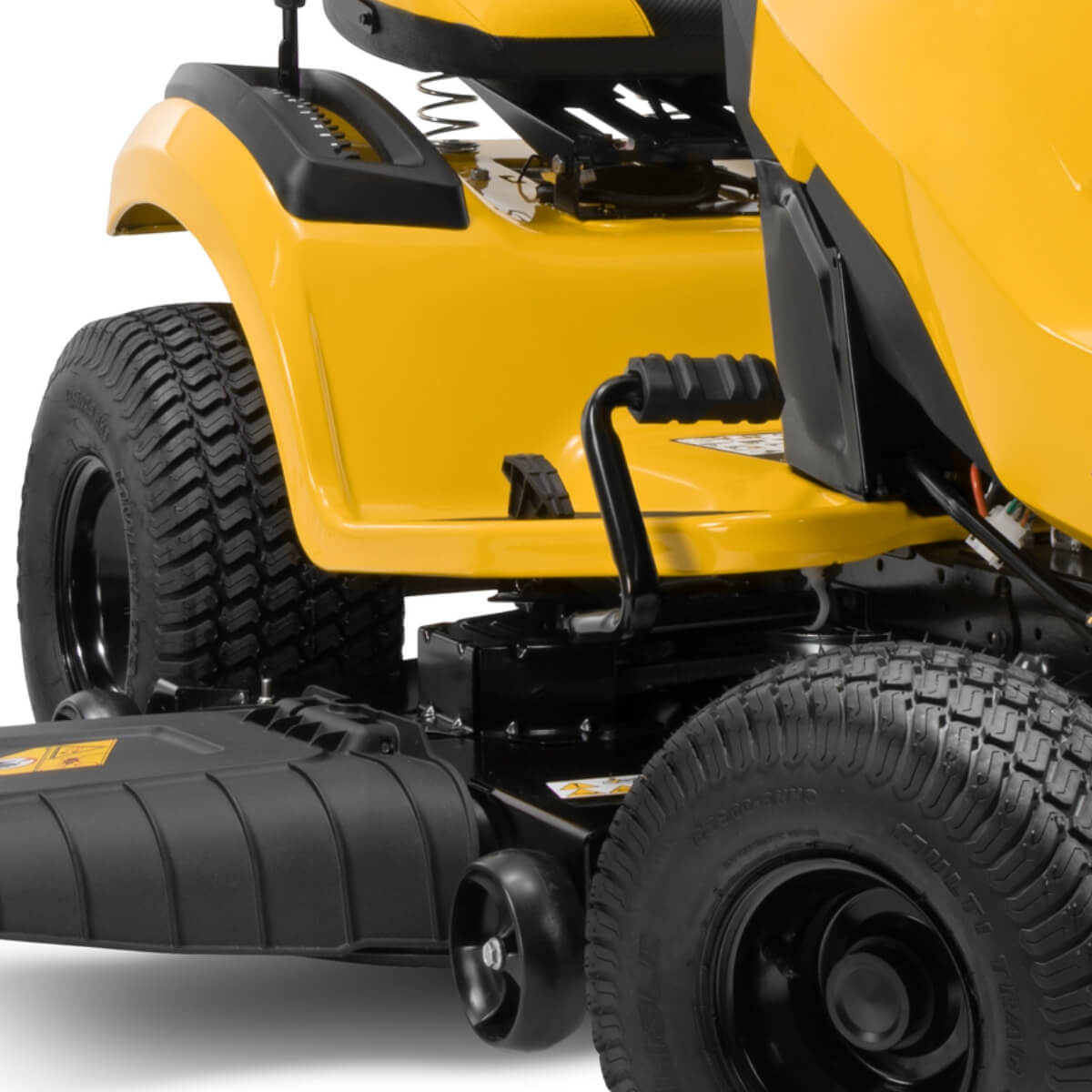 Close-up of a yellow Cub Cadet XT2 LX 46 ride on lawn mower with black tires on a white background