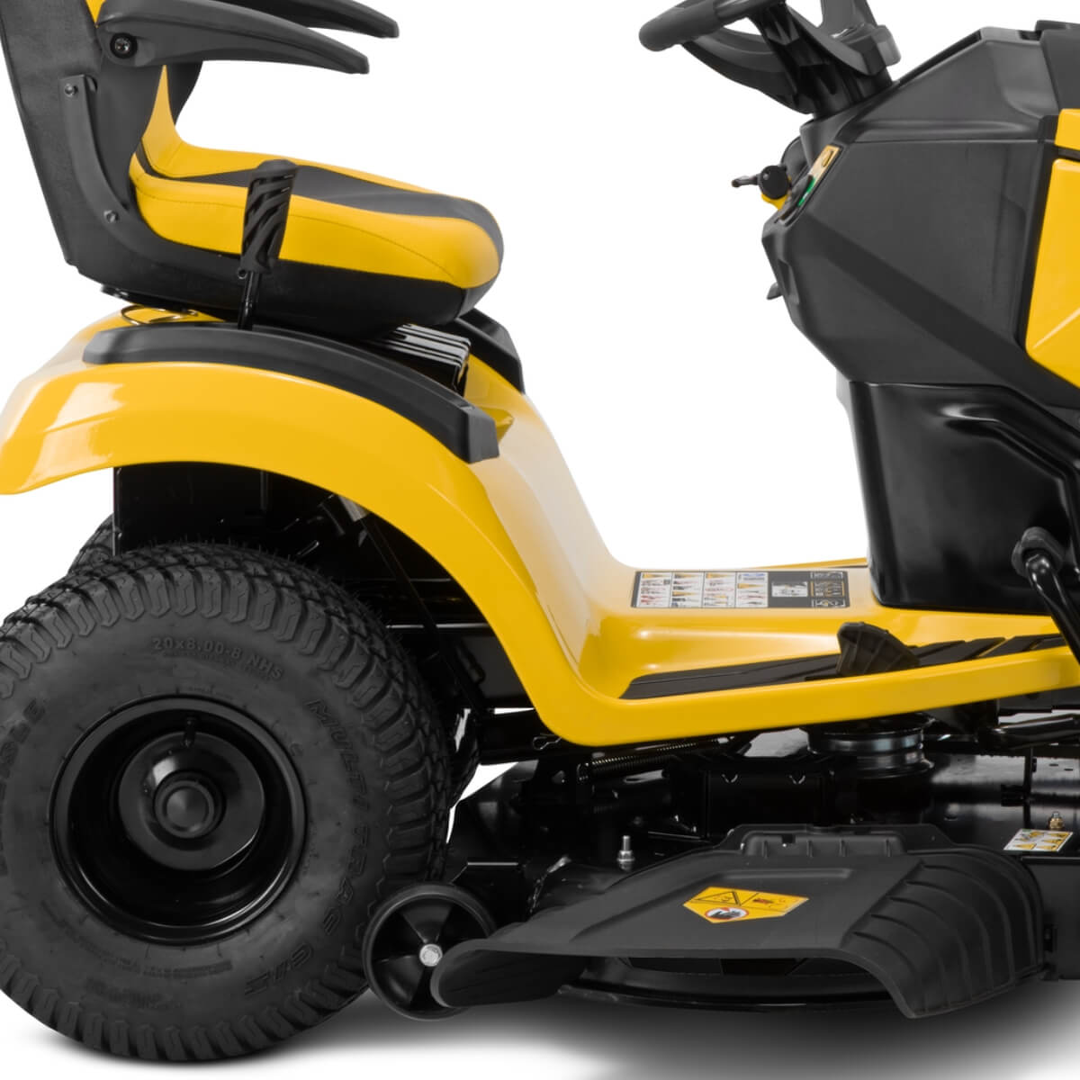 Yellow Cub Cadet riding lawn mower on a white background showing a view from the side
