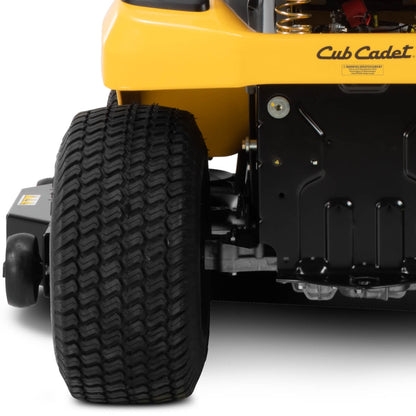 Close-up of a Cub Cadet ride on lawn mower tire on a white background viewed from the rear