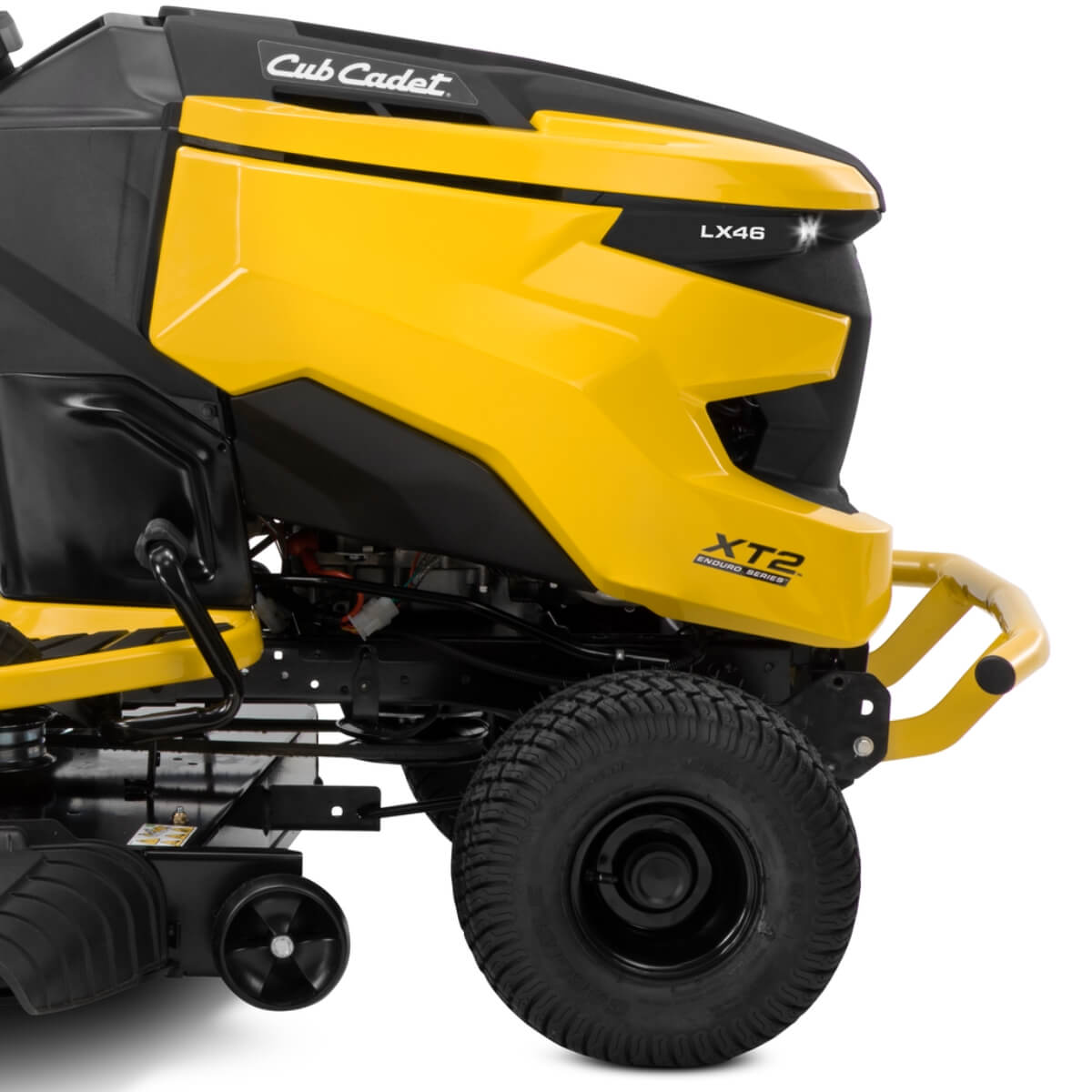 Detailed close up photograph of the yellow and black Cub Cadet XT2 ride on lawn mower on a white background