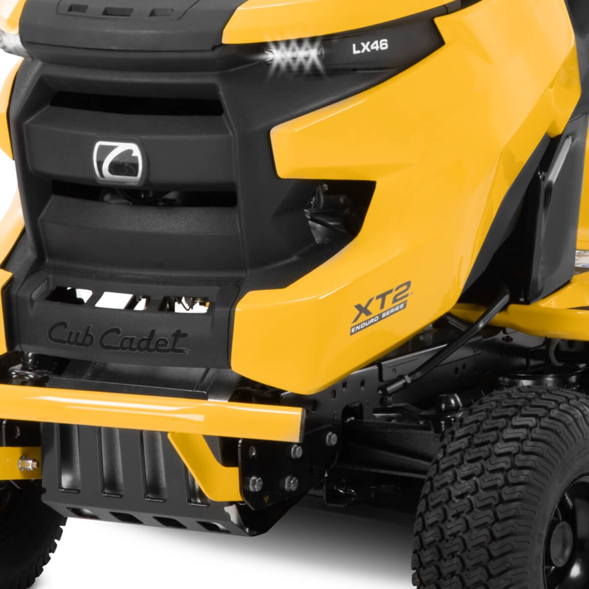 Close-up of a yellow Cub Cadet XT2 ride on lawn mower on a white background