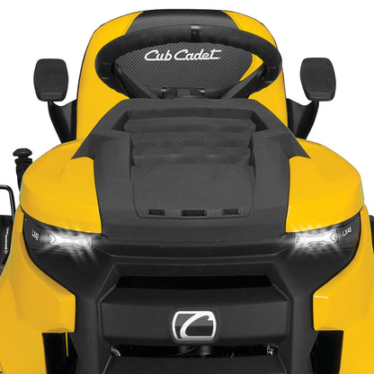 Yellow XT2 LX Cub Cadet lawn mower with black seat on a white background shown from the front with lights on