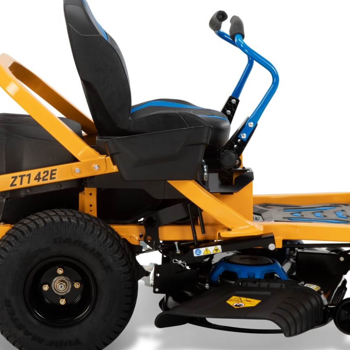Close-up view from the side of a yellow Cub Cadet ZT1 ride on lawn mower with black seat and blue handle on a white background.