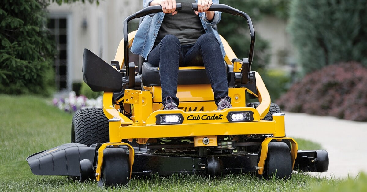Ultima yellow Cub Cadet riding mower in action.