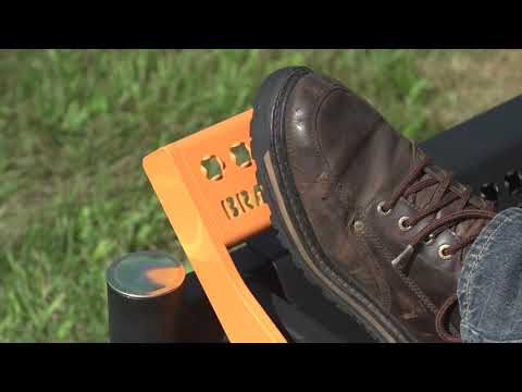Man demonstrating and mowing with the SCAG Patriot ride on mower
