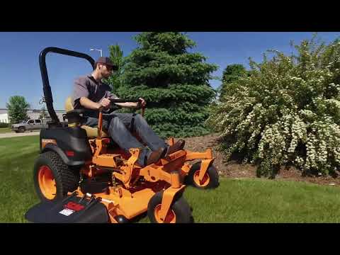 Demonstration showing man mowing lawn with the Scag Tiger Cat II zero turn ride on mower