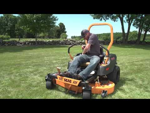 Demonstrating the SCAG Freedom ride on mower.