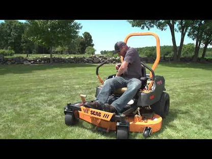 Demonstrating the SCAG Freedom ride on mower.