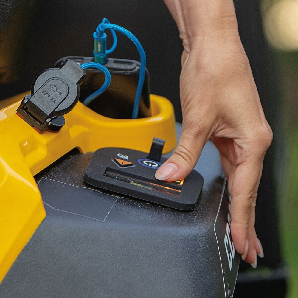 Ride on mower operator turning on the start switch