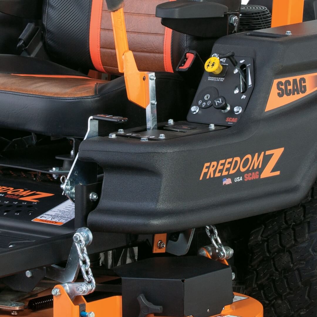 Close-up of a SCAG Freedom Z lawn mower with branding and features.