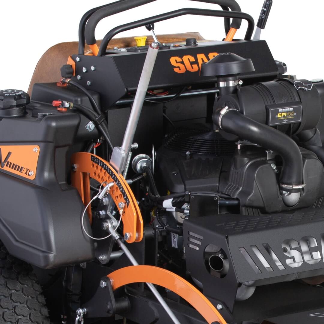 Close-up of a SCAG lawn mower engine with visible branding on a white background