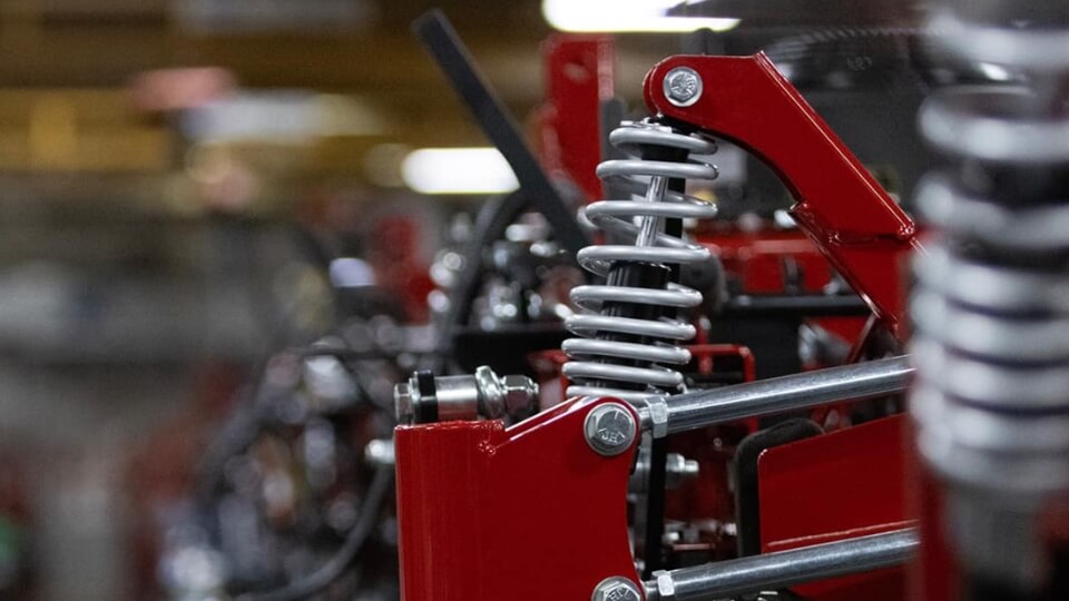 Close view of the suspension springs of the Ferris ride on mower.